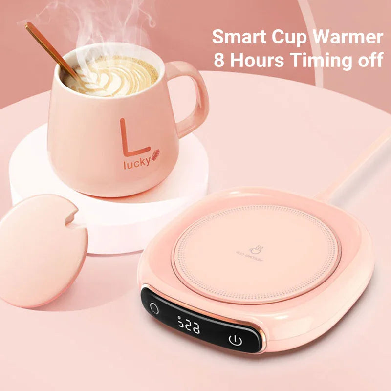 Smart coffee mug warmer with pink mug and temperature display on desk