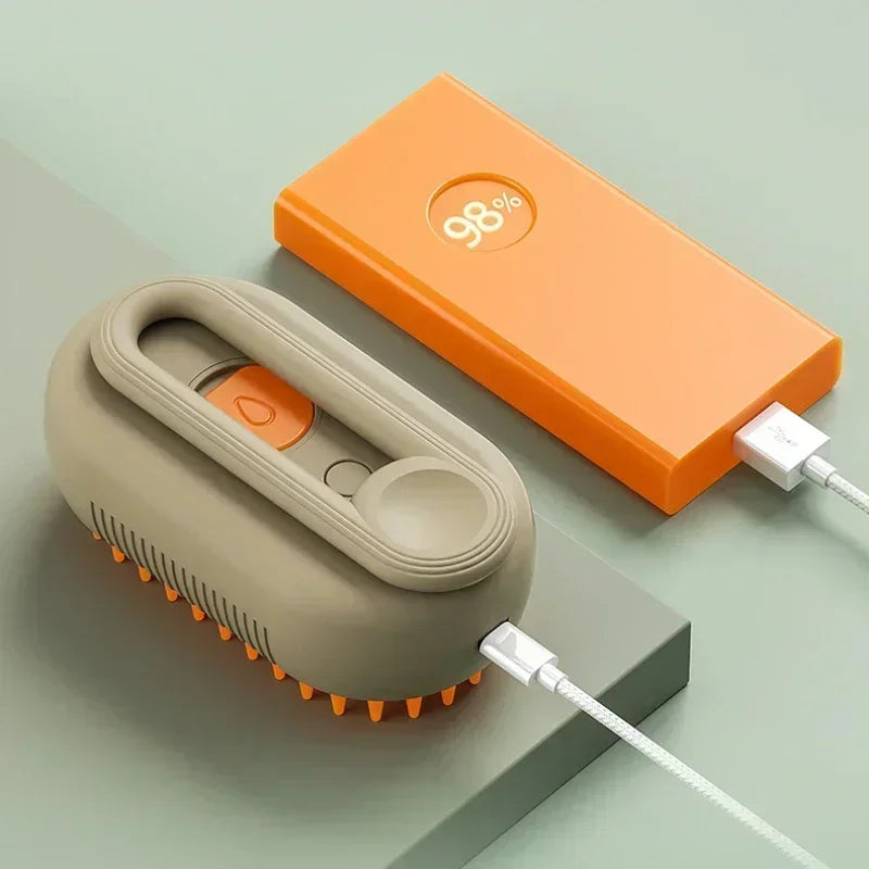 Orange steam brush for dog grooming and massage